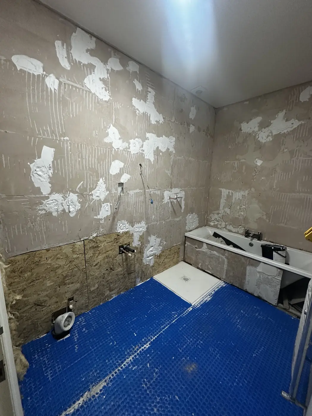 Bathroom floor protected during first-fix preparation